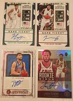 Front of four autographed basketball trading cards featuring Kenyon Martin Jr, Tyrique Jones, Ty Jerome, and Lamar Stevens.