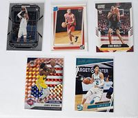 Front of five rookie basketball cards from Panini including Victor Wembanyama 2023 Prizm, Scottie Barnes 2021 Rated Rookie, Evan Mobley 2022 Score, James Wiseman 2021 Mosaic National Pride, LaMelo Ball 2021 Rookie cards.