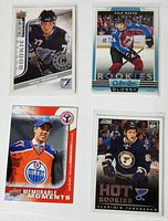 Front photo showing four rookie hockey cards: Victor Hedman (2009 Upper Deck), Cale Makar (2019 OPC Glossy), Connor McDavid (2016 Upper Deck Memorable Moments), Vladimir Tarasenko (2013 Score Panini Hot Rookie).