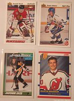 Four hockey rookie cards shown front side including Teemu Selanne, Jaromir Jagr, Dominik Hasek, Martin Brodeur