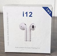 Box showing i12 branding and TWS True Wireless Stereo label with features like Auto power-On and Auto Pairing 5.0