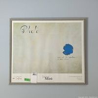Framed print of Joan Miró artwork with title and descriptive text visible, showing overall condition and frame details.