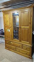 Front view of entire wardrobe showing three doors and bottom drawer section