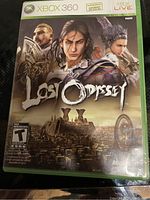 Front cover of the Lost Odyssey Xbox 360 game case showing game title and artwork featuring three characters and a landscape.