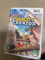 Image shows front cover of SimCity Creator game case for Nintendo Wii, includes rating and Wi-Fi support.