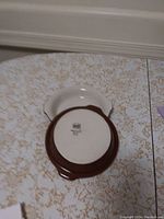 Bowl underside showing Hall brand mark and oven safe indication