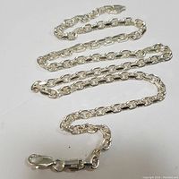 Full length of men's chain necklace laid out to show entire chain and clasp.