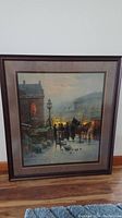 Framed G. Harvey print depicting winter street scene with people and horse-drawn carriage, showing full artwork and frame.