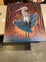 Full front view of the canvas painting depicting a blue heron in a marsh setting