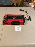 Photo of EverStart 1000 Watt power inverter on table, showing device and attached cables.