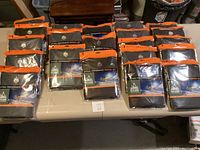 Photo showing all 18 thermal sets in sealed packaging laid out on a table.