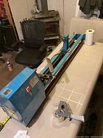 Full view of blue Jet wood lathe on folding table