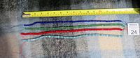 Four quartz bead strands in blue, green, red, and light blue, aligned with a measuring tape showing approx. 26 inches length each