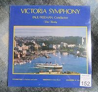 Front cover of 1983 Victoria Symphony vinyl album sealed in shrink wrap with a photo of a harbor and city