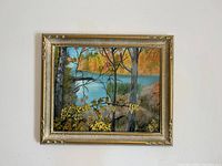 Front view of the framed painting showing the landscape and autumn colors.