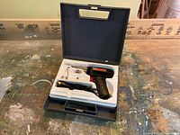 Weller soldering kit in open case showing the soldering gun and accessories inside fitted foam packaging.