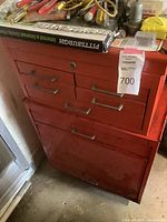 Vintage reddish orange rolling and stacking toolbox with multiple drawers