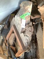 Four large wood burl pieces stacked, the tallest one standing over 36 inches high with natural textured surfaces