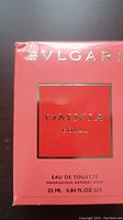 Front view of unopened Bvlgari Omnia Coral Eau de Toilette box showing coral red packaging with silver foil details.