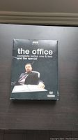 Front cover of The Office DVD box set with Ricky Gervais image and title text