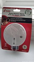 Kidde Quiet Nuisance Smoke Alarm in its original red and white sealed packaging, model i9060CA.