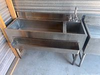 Full front view of the 48-inch stainless steel ice well and sink unit