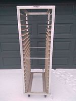 Front view of Metro baking rack showing multiple shelves and casters.