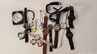 Overview of all timepieces including wristwatches, pocket/pendant watches, and travel clock.
