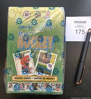 Front view of the sealed 1992-93 OPC Premier hockey card wax box showing the original OPC seal with minor tear.