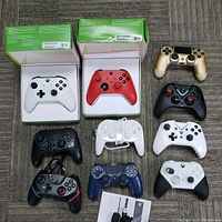 Top-down view of all 10 controllers arranged showing color, boxed and unboxed controllers
