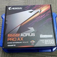 Front of the retail box showing the Gigabyte B550I Aorus Pro AX branding and compatibility for AMD Ryzen 5000 desktop processors, AM4 socket, B550 chipset, and gaming motherboard status.