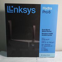 Front view of LinkSys Hydra Pro 6 router packaging showing model, features, and specifications.