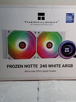 Front box view showing Thermalright branding, product name Frozen Notte 240 White ARGB, image of dual ARGB fans and pump block, Intel 17xx socket compatibility.