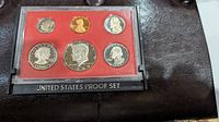 Front view showing obverse side of proof coins in the set, including Kennedy half dollar, Washington quarter, Roosevelt dime, Jefferson nickel, and Lincoln cent.