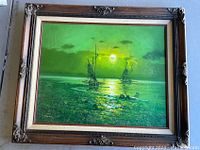 Front view of Ships on the Sea framed print showing wood frame and maritime scene with ships and sun