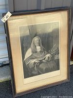 Framed portrait print of Sir A.E. Cockburn with visible wood frame and backing board.