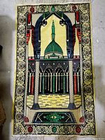Full view of vintage Islamic prayer rug showing mosque architecture, green dome, minaret, and ornamental border.