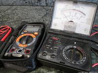 Both Micronta analog multimeter and Kaiweets digital multimeter side by side showing devices and test cables