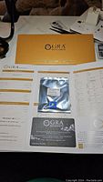 Golden yellow round moissanite in sealed packaging with GRA certification documents for authenticity and grading.