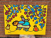 Full front view of stretched canvas painting with vibrant yellow background and stylized subject