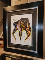 Framed silkscreen artwork by Norman Knott titled Creation, showing indigenous art style with human profile, bird, turtle, and sun symbols.