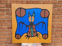 Front view of the original acrylic painting by Josh Kakegamic showing the entire artwork with blue, brown, orange and black colors on a mustard yellow background.