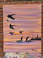 Full view of the original acrylic painting featuring loons flying and swimming at sunset with a tree silhouette background.