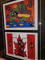 Framed pair of prints showing both 'Bear Walker' (top) with colorful stylized bear and birds, and 'Canada' (bottom) depicting a stylized figure and Canadian flag in red and white.