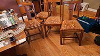 Overall view of all four oak chairs arranged together