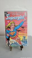 Front cover of the Supergirl comic book showing Superman emblem and city backdrop.