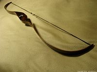 Full length view of recurve bow with string attached