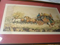 Full view of framed print depicting horse-drawn stagecoach with several figures and four horses, showing slight stain on the left side.