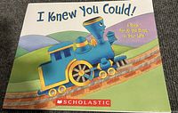 Cover of the book 'I Knew You Could!' featuring a blue train on a track with hills in the background