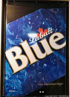 Close-up of the fridge's front door showing Labatt Blue branding